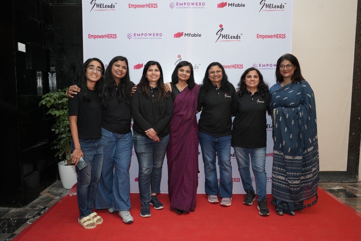 Team with event backdrop